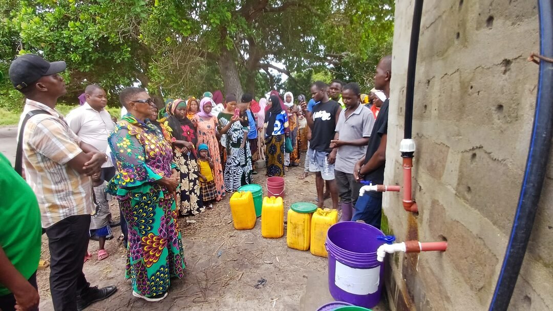 Community members gathered at a water point